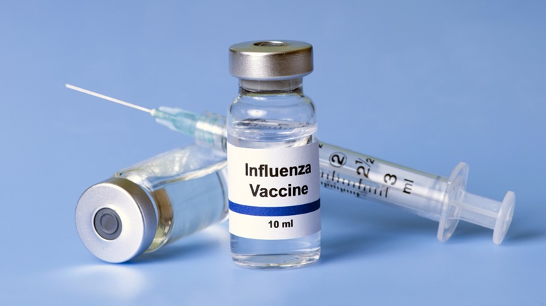 Flu vaccine and syringe
