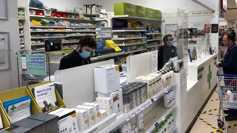 Pharmacists wearing face masks