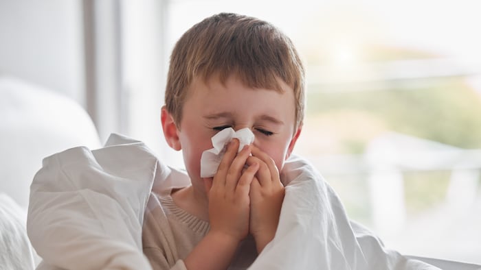 Child blowing nose