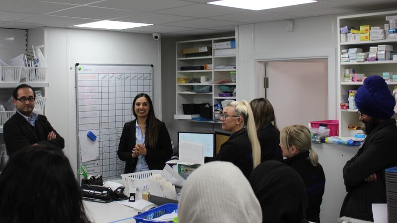 Sukhy Somal leads a team meeting