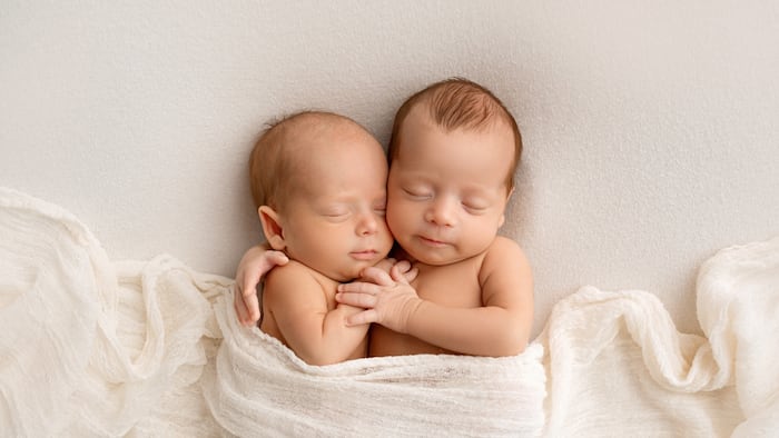 two tiny newborn babies