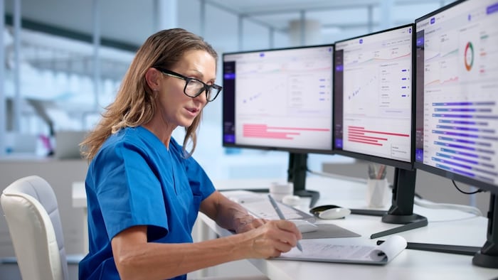 Clinical Trial Manager Monitors Patient Enrollment Progress Using Dashboard Software.