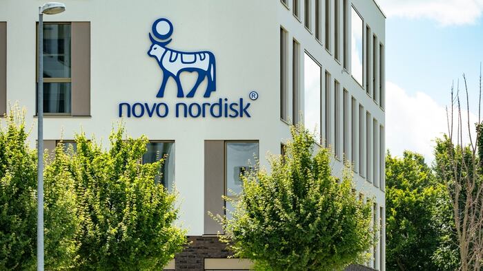 Novo Nordisk's logo on a building in the distance