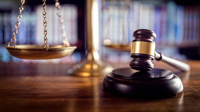 Gavel, scales, law books (Brian Jackson/Alamy Stock Photo)