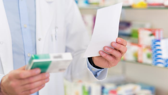 Pharmacist filling prescription