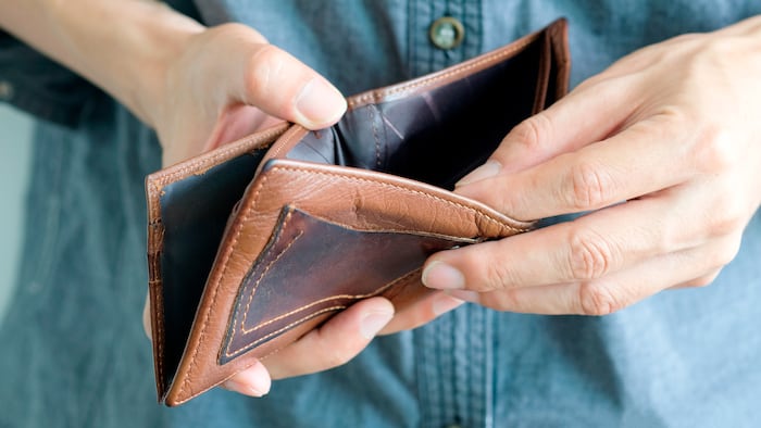 Hands holding empty wallet