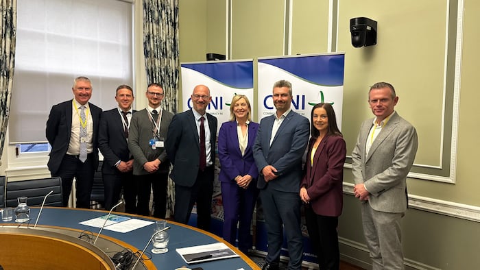 A group of people at a parliamentary meeting.