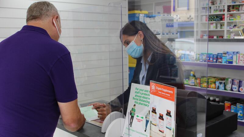 Sukhy Somal assists a patient