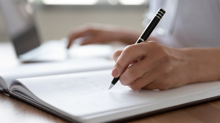 Pharmacist writing