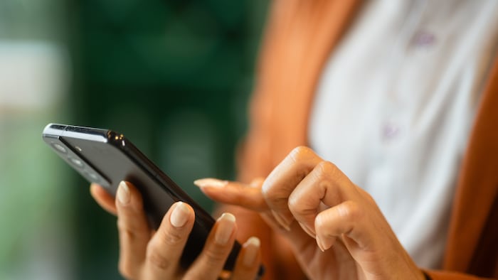 Person using touch screen phone