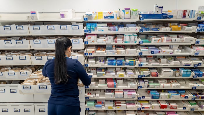 Pharmacy staff and medicine stock