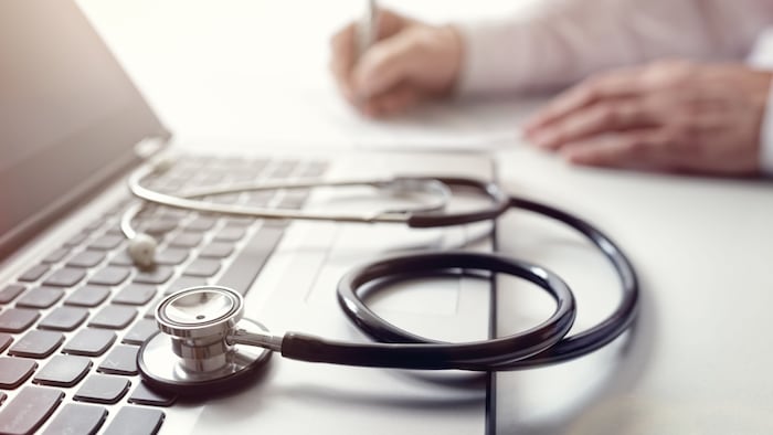Gp next to laptop