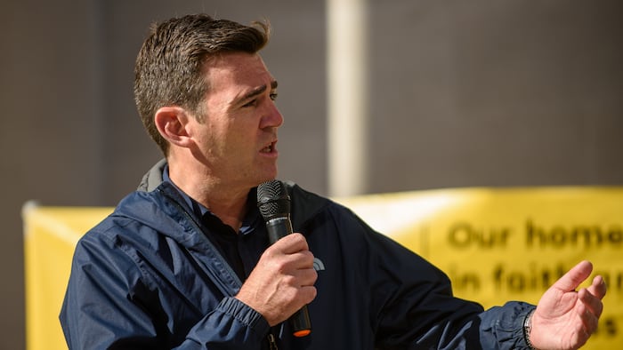 Andy Burnham in a jacket giving a speech outdoors in 2021